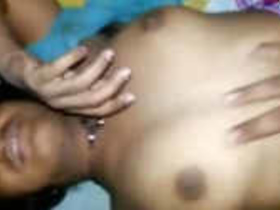 Indian wife reveals her large breasts by unbuttoning her blouse
