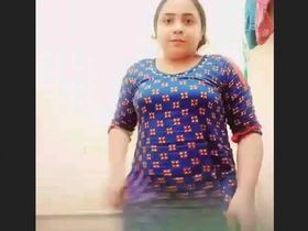 Beautiful babe strips naked in front of the camera