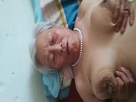 Saggy boobed Chinese granny gets naughty in public