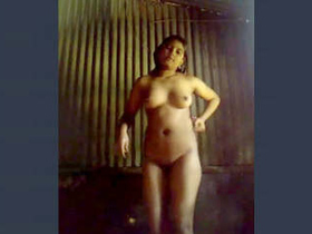 A stunning village belle from India sensually undressing and performing a dance routine post-bath
