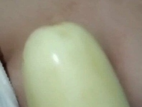 Steamy video of aroused woman pleasuring herself with a cucumber