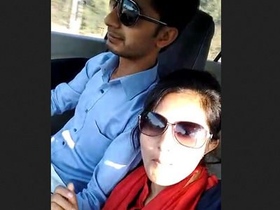 A couple engages in sexual activity recorded on their mobile phone while in a car