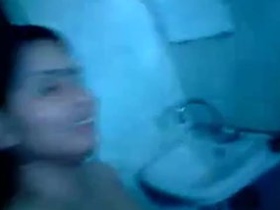 Indian aunty in saree bathing and pleasing herself