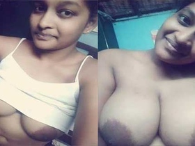 Tamil babe flaunts her massive breasts in a naughty video