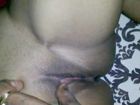 A sultry Indian wife enjoys penetrative sex