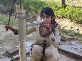 Pakistani beauty indulges in a sultry open-air bath