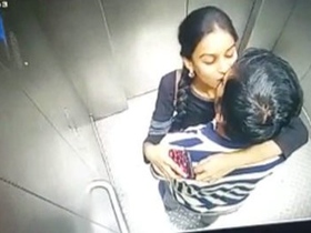 Spy on a hot couple in the elevator as they engage in steamy sex