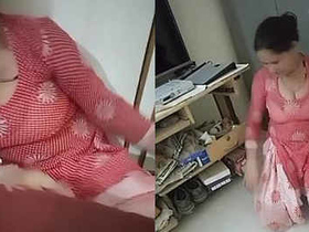 Busty maid flaunts her assets while cleaning