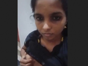 A petite Andhra girl flaunts her modest breasts on camera