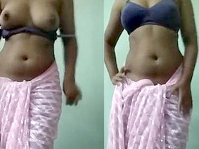 Indian beauty fondles her ample breasts on camera