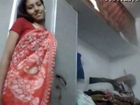 A young and horny girl in a saree seductively strips for money