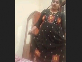 Indian babe's sensual striptease: Watch her reveal her perky boobs and pussy