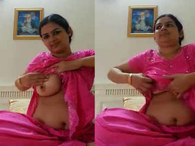 Nurse in pink salwar suit gives a seductive selfie with moans