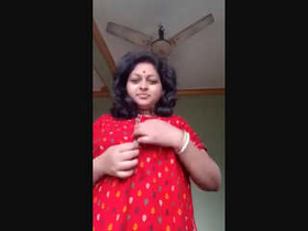 Indian housewife flaunts her big breasts and pussy in a sensual video