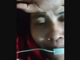 Young woman pleasures herself with her fingers in a sensual video